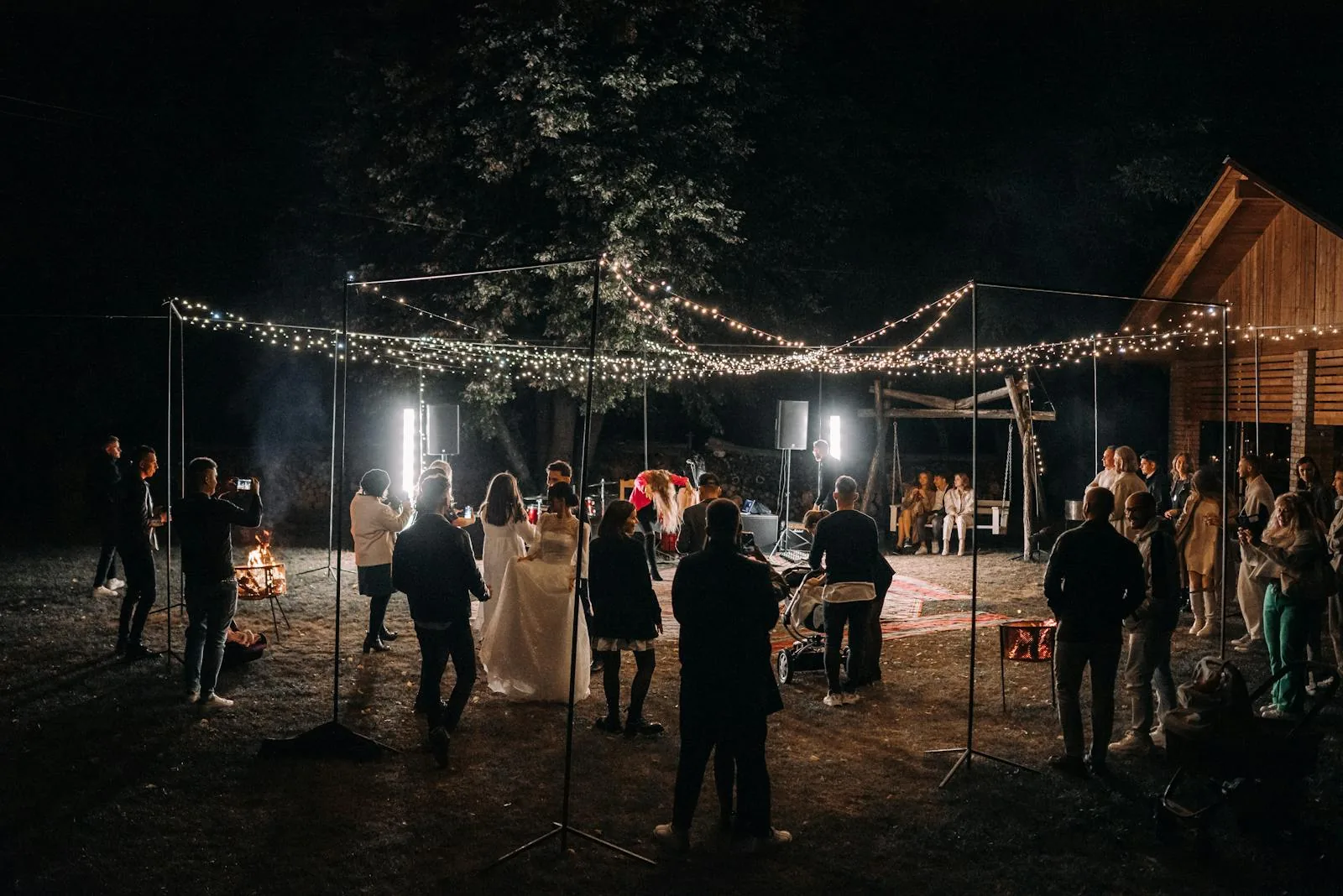 Outdoor wedding reception under string lights
