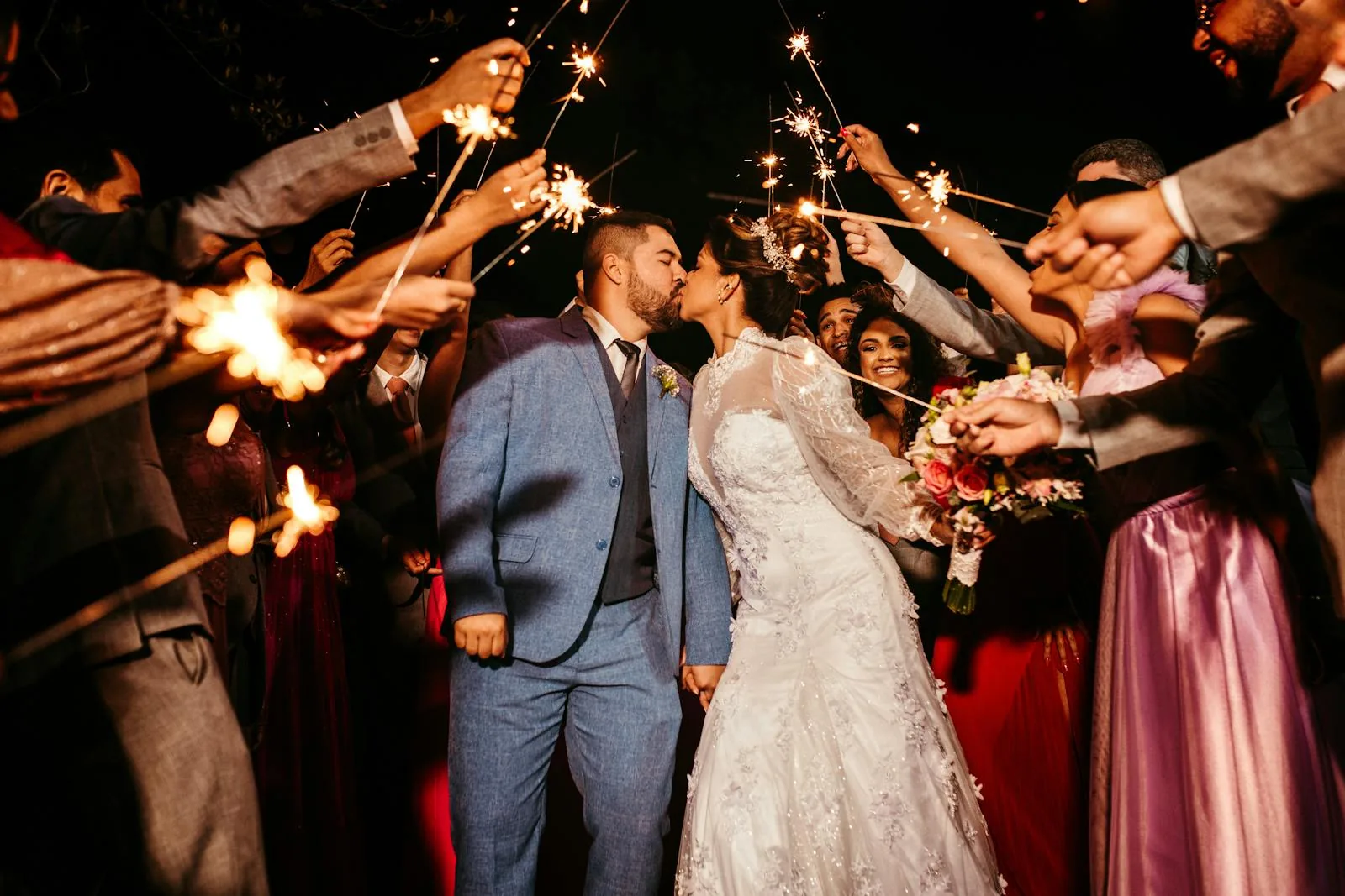 Sparkler send-off around the couple at a wedding