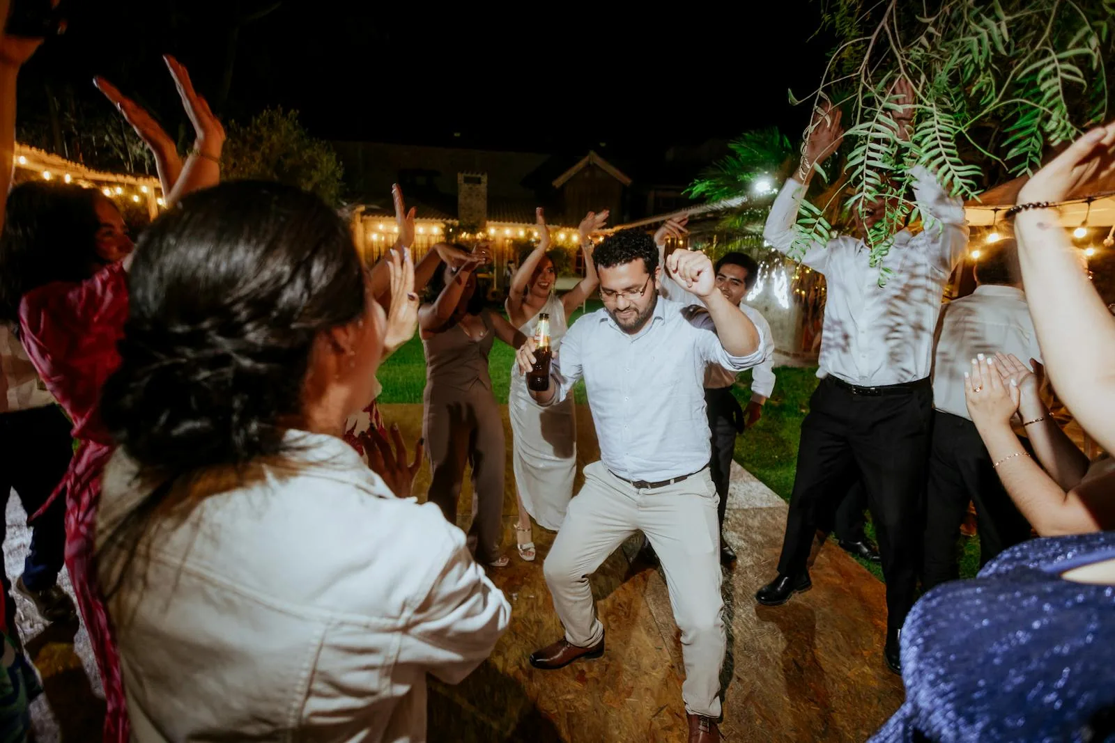 Wedding reception dance floor under string lights